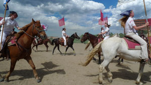 Young riders practicing "threading the needle" at a canter