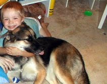child hugging dog