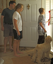 family waiting at door